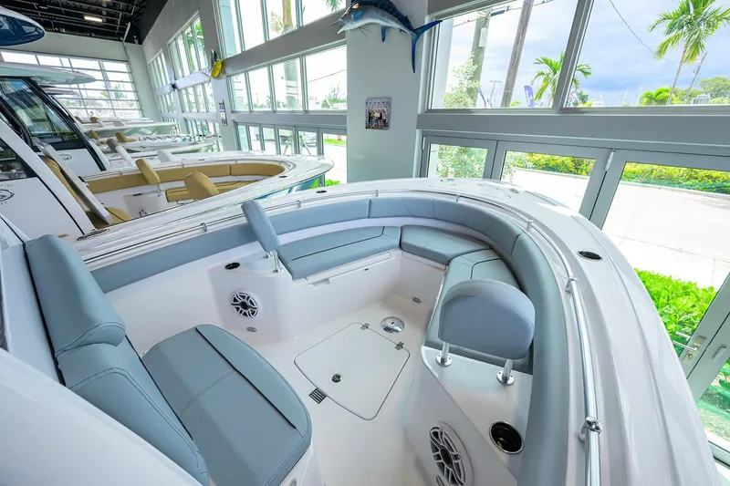 Slide: The Image of 2026 Sportsman Heritage 231 Center Console boat interior with seating and modern design. - 4