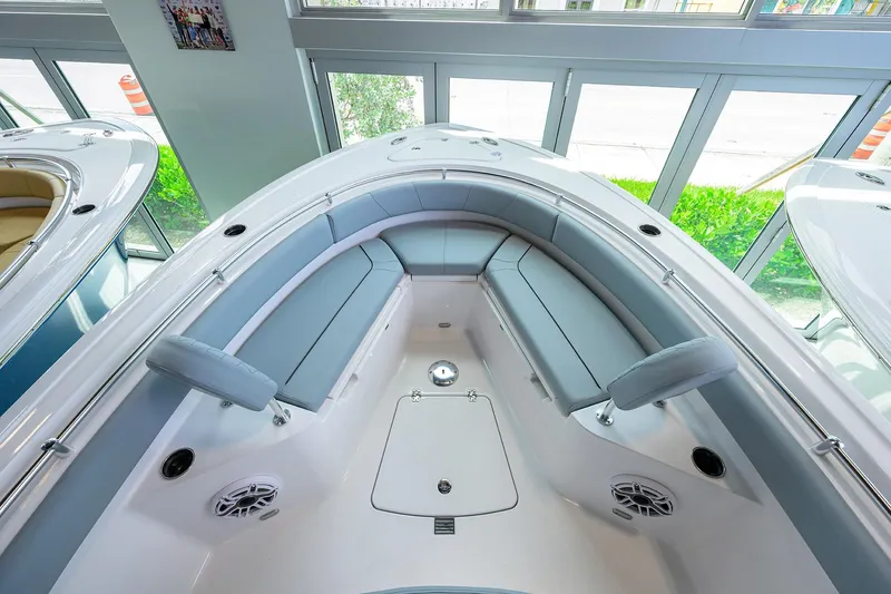 Slide: The Image of 2026 Sportsman Heritage 231 Center Console boat interior with cushioned seating and modern design. - 5