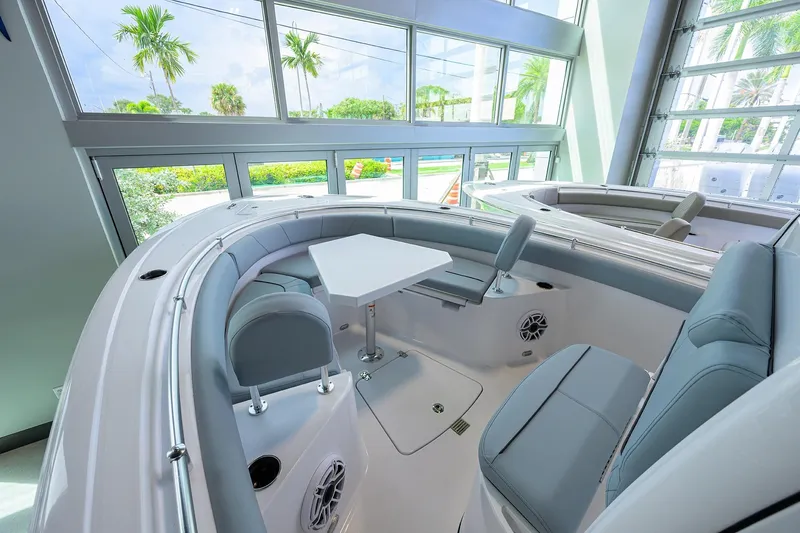 Slide: The Image of 2026 Sportsman Heritage 231 Center Console interior with seating and table, showcasing modern design. - 7