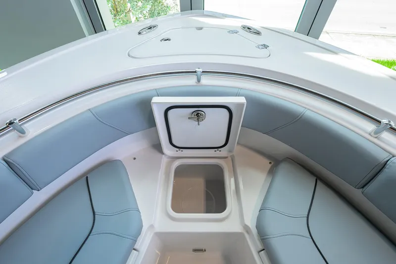 Slide: The Image of 2026 Sportsman Heritage 231 Center Console boat interior with seating and storage. - 8