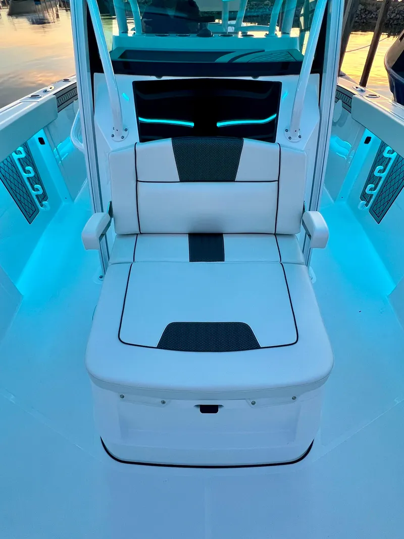Slide: The Image of 2026 Wellcraft 352 Fisherman boat interior with illuminated seating and modern design. - 14