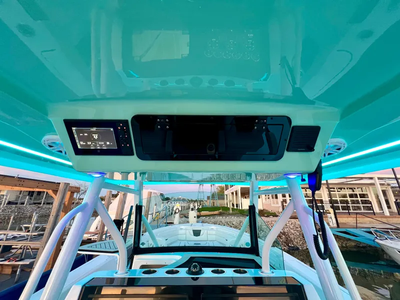 Slide: The Image of 2026 Wellcraft 352 Fisherman boat interior with modern dashboard and controls. - 21