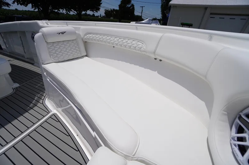Slide: The Image of Luxurious seating on 2026 Tidewater 282 CC Adventure boat, featuring elegant white upholstery. - 10