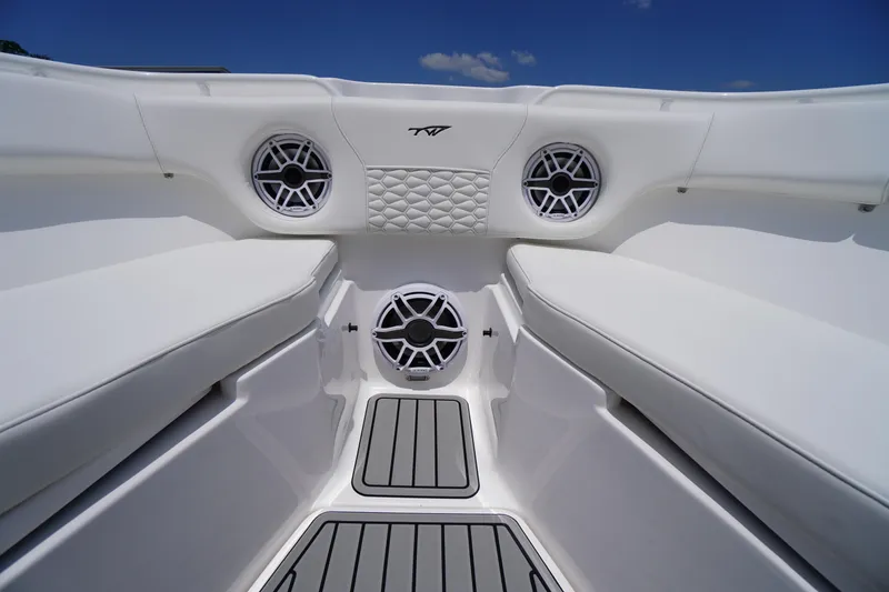 Slide: The Image of 2026 Tidewater 282 CC Adventure boat interior with cushioned seating and built-in speakers. - 11