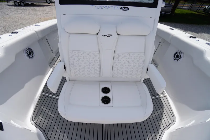 Slide: The Image of 2026 Tidewater 282 CC Adventure boat interior with white seating and cup holders. - 19