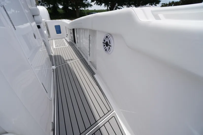 Slide: The Image of 2026 Tidewater 282 CC Adventure boat deck with sleek design and modern features. - 21