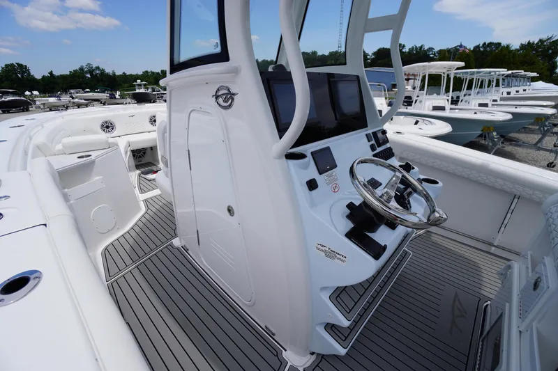 Slide: The Image of 2026 Tidewater 282 CC Adventure boat cockpit with modern controls and sleek design. - 24
