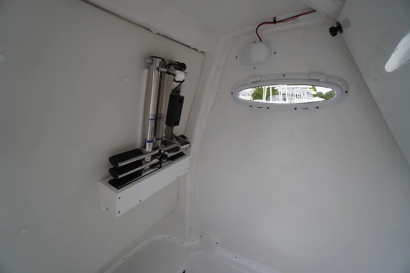 Slide: The Image of Interior of 2026 Tidewater 282 CC Adventure boat with window and mounted equipment. - 28
