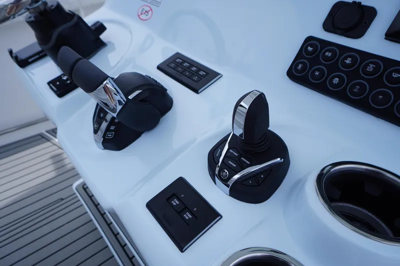 Slide: The Image of Control panel of 2026 Tidewater 282 CC Adventure boat with joystick and throttle. - 33
