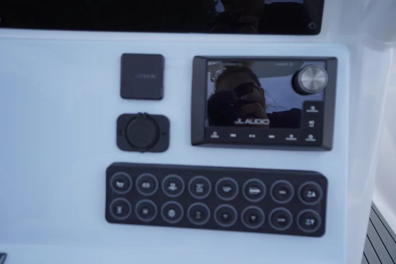 Slide: The Image of Control panel of 2026 Tidewater 282 CC Adventure boat with JL Audio system. - 34