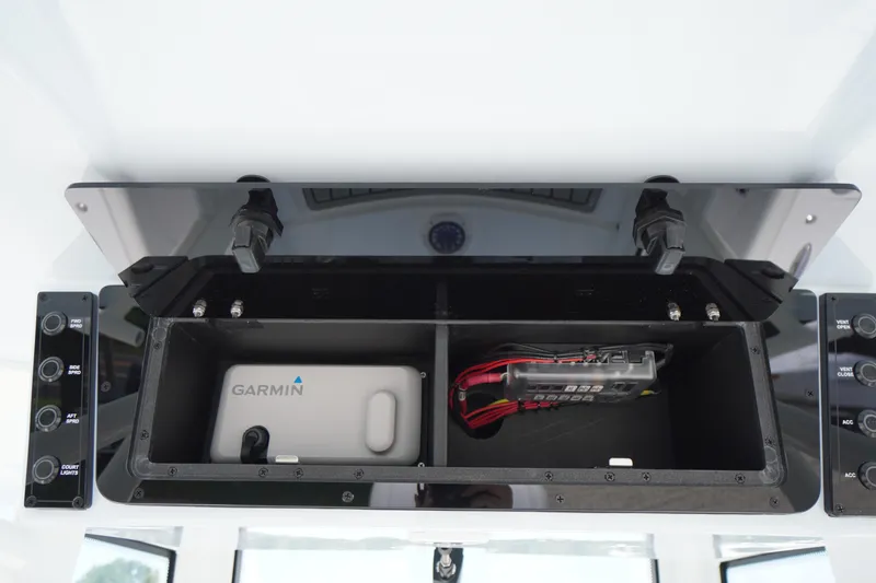 Slide: The Image of 2026 Tidewater 282 CC Adventure boat console with Garmin device and control panel. - 40