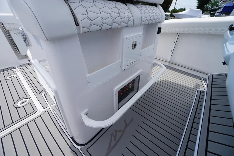 Slide: The Image of 2026 Tidewater 282 CC Adventure boat interior with sleek seating and modern flooring design. - 41