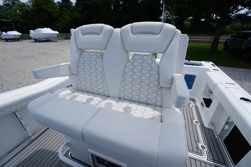 Slide: The Image of 2026 Tidewater 282 CC Adventure boat with luxurious white seating and modern design. - 42