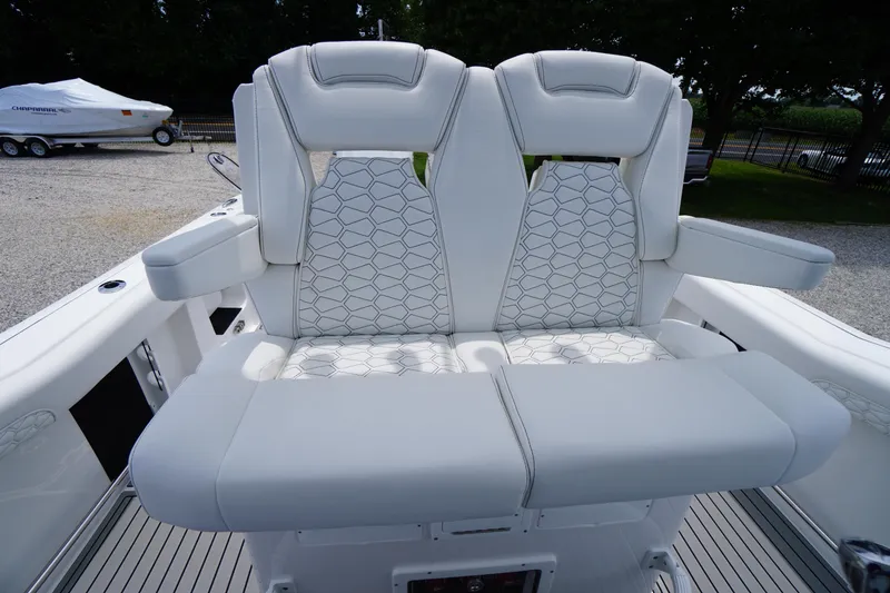 Slide: The Image of 2026 Tidewater 282 CC Adventure boat seats with white upholstery and armrests. - 43