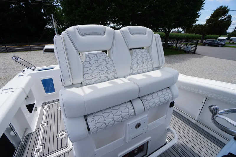 Slide: The Image of 2026 Tidewater 282 CC Adventure boat with luxurious white seating and modern design. - 44