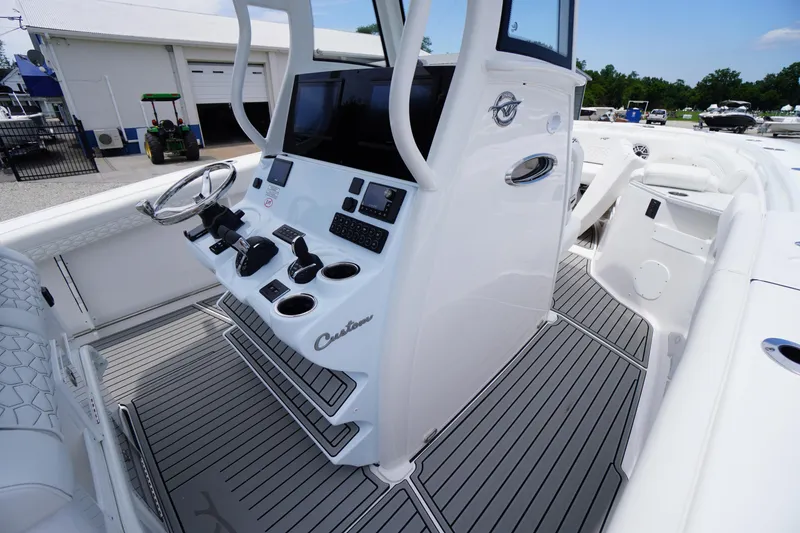 Slide: The Image of 2026 Tidewater 282 CC Adventure boat cockpit with modern controls and sleek design. - 45