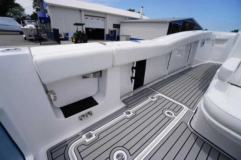Slide: The Image of 2026 Tidewater 282 CC Adventure boat interior with sleek seating and modern flooring. - 47