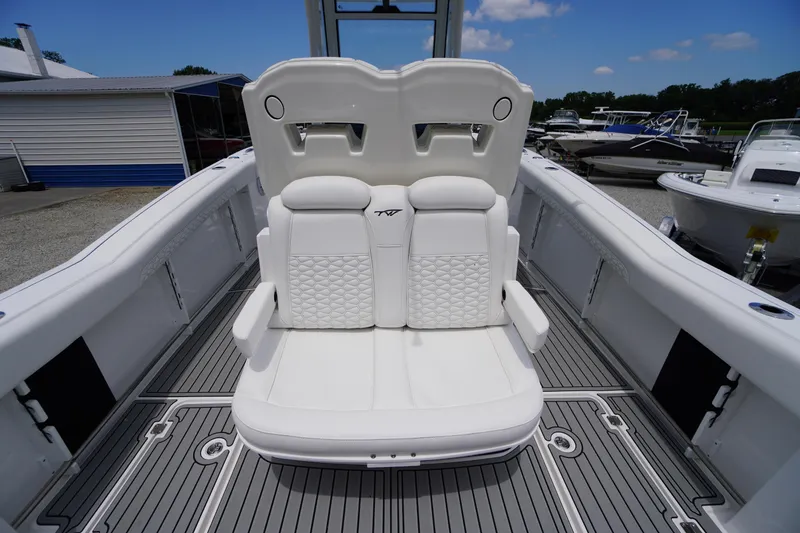 Slide: The Image of 2026 Tidewater 282 CC Adventure boat with luxurious white seating and sleek deck design. - 48