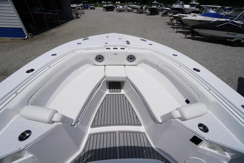 Slide: The Image of 2026 Tidewater 282 CC Adventure boat interior with white seating and modern design. - 5