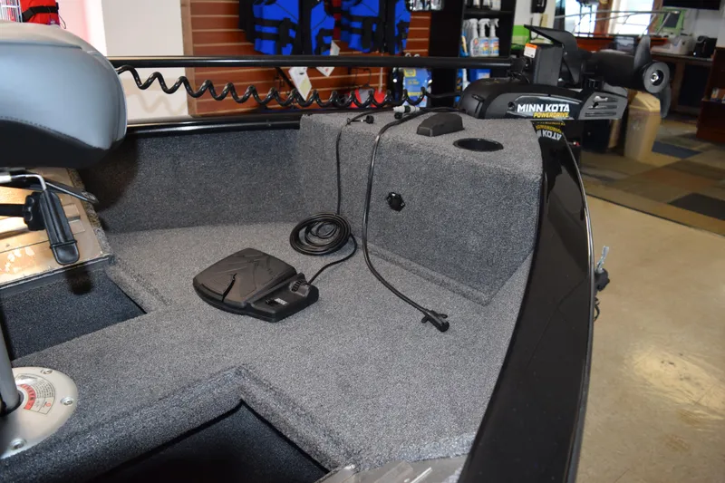 Slide: The Image of 2025 Tracker Super Guide V16 T boat interior with Minn Kota trolling motor. - 12