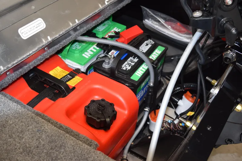 Slide: The Image of 2025 Tracker Super Guide V16 T boat battery and fuel compartment. - 16