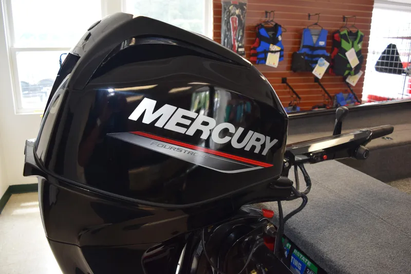 Slide: The Image of Mercury FourStroke engine on 2025 Tracker Super Guide V16 T boat in showroom. - 18