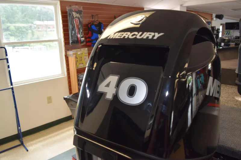 Slide: The Image of Mercury 40 horsepower outboard motor in a showroom, Tracker Suoer Guide V16 T, 2025 model. - 19