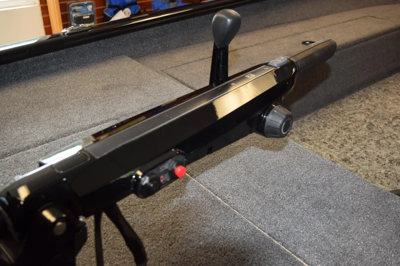 Slide: The Image of 2025 Tracker Super Guide V16 T boat interior with control panel and lever. - 20