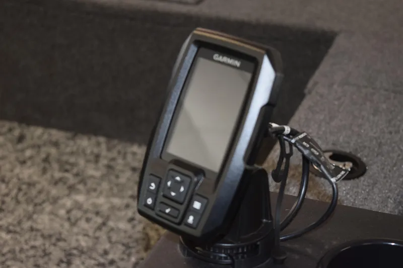 Slide: The Image of Garmin device mounted on 2025 Tracker Suoer Guide V16 T boat dashboard. - 22