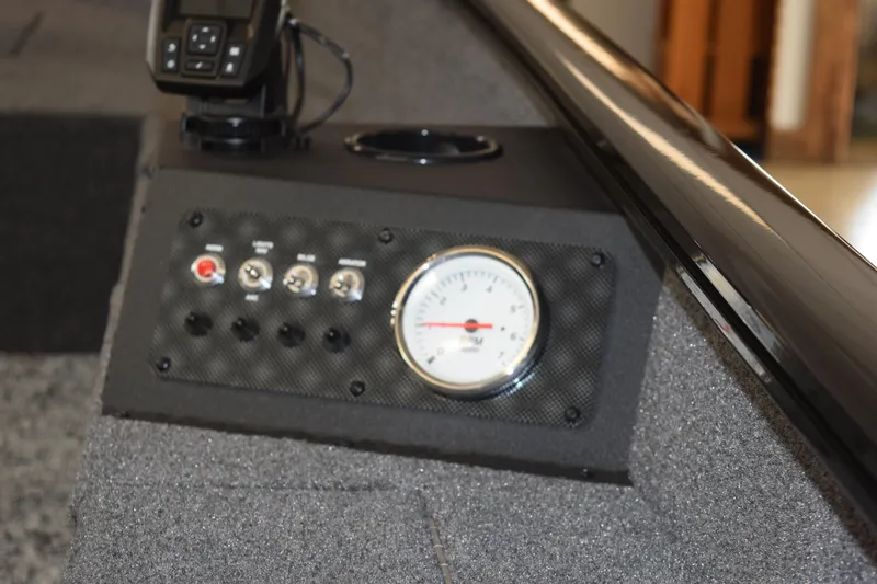 Slide: The Image of Control panel of 2025 Tracker Super Guide V16 T boat with gauge and switches. - 5