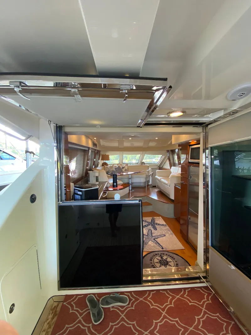Slide: The Image of Interior view of 2008 Sea Ray 47DB yacht, featuring luxurious seating and modern decor. - 13