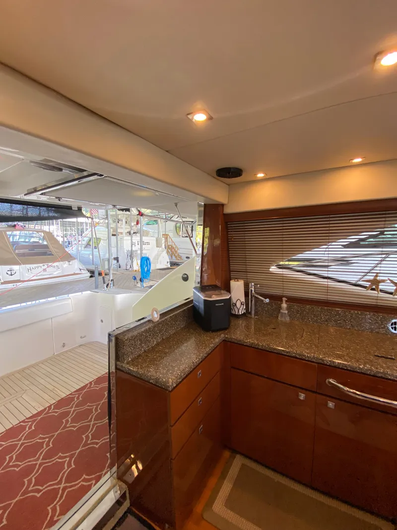 Slide: The Image of Interior view of 2008 Sea Ray 47DB yacht with modern kitchen and outdoor deck. - 14