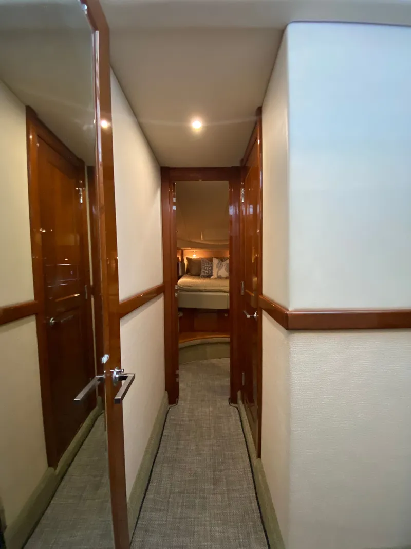 Slide: The Image of 2008 Sea Ray 47DB yacht interior hallway leading to a cozy bedroom. - 20