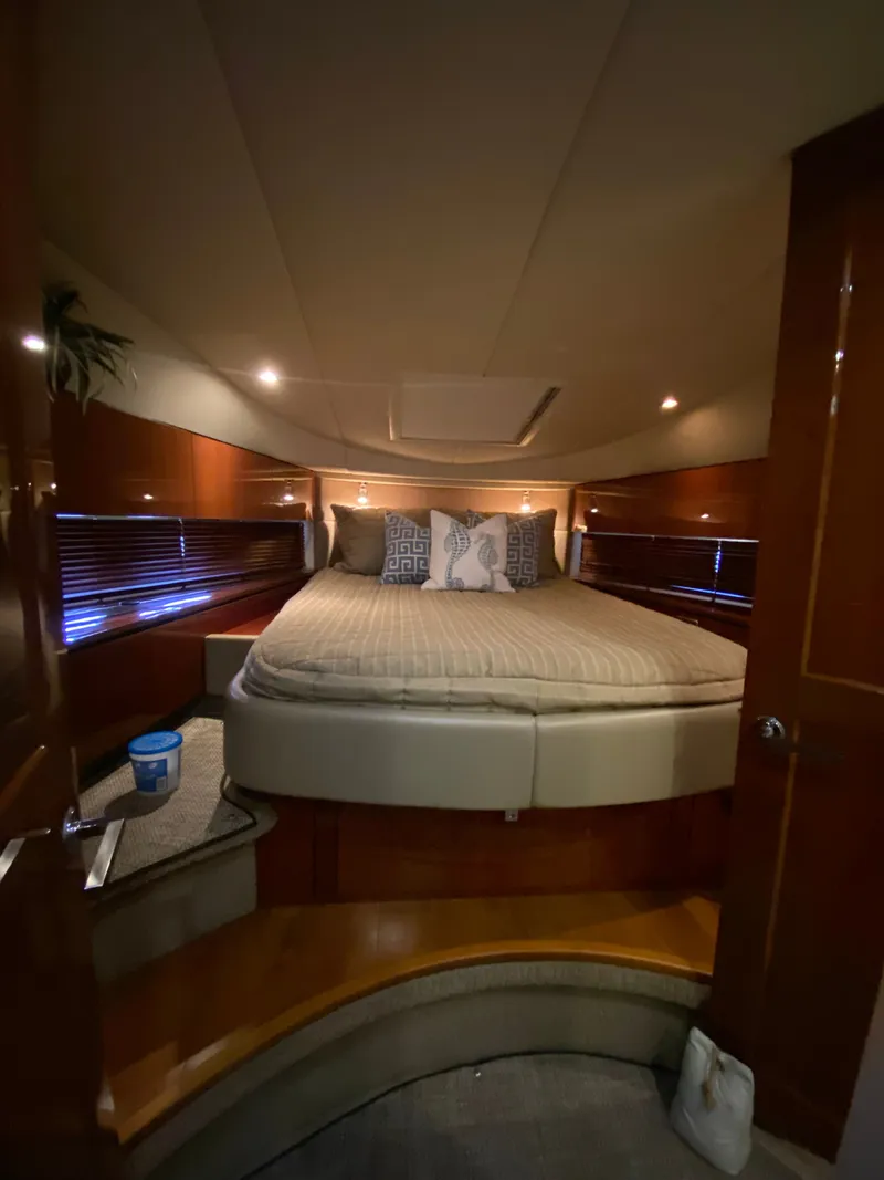 Slide: The Image of Luxurious bedroom interior of 2008 Sea Ray 47DB yacht with elegant bedding and wood accents. - 22