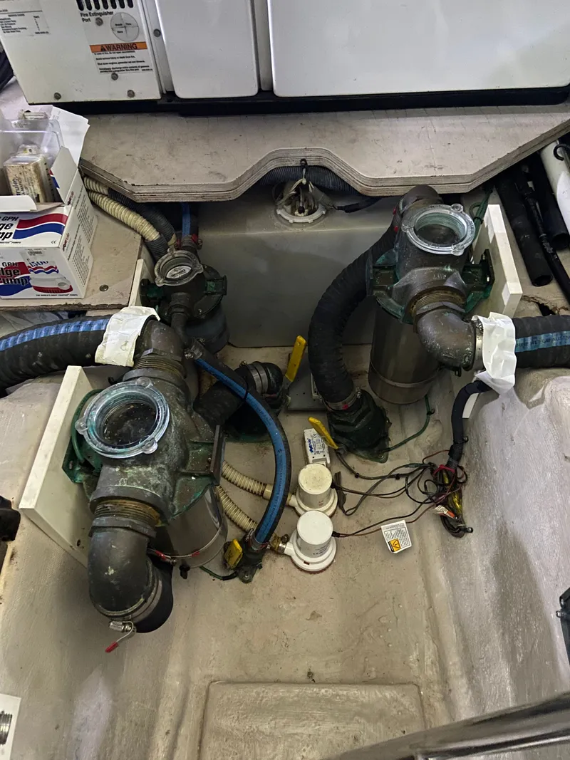 Slide: The Image of Engine compartment of a 2008 Sea Ray 47DB yacht, showing mechanical components and wiring. - 38