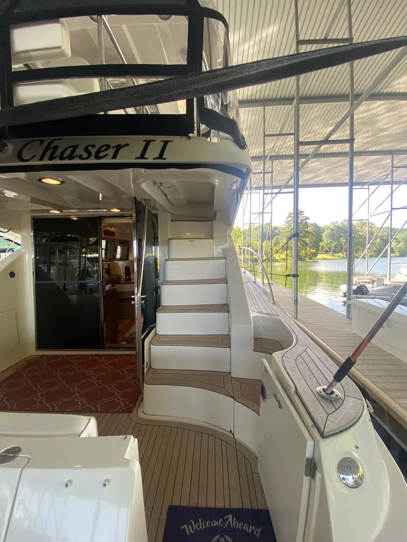 Slide: The Image of 2008 Sea Ray 47DB yacht interior with stairs, docked under a covered marina. - 4