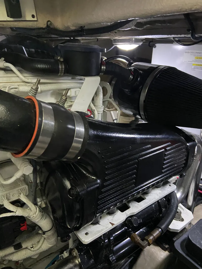 Slide: The Image of Engine compartment of a 2008 Sea Ray 47DB yacht, showcasing detailed mechanical components. - 42