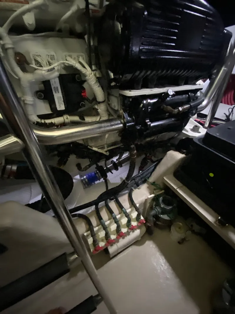 Slide: The Image of Engine room of a 2008 Sea Ray 47DB yacht, showcasing mechanical components and wiring. - 44