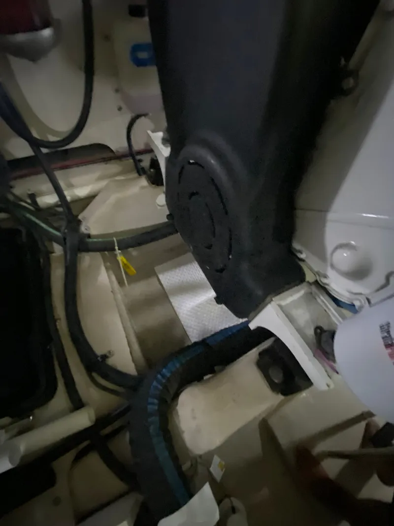 Slide: The Image of Engine compartment of a 2008 Sea Ray 47DB boat, showing hoses and components. - 45