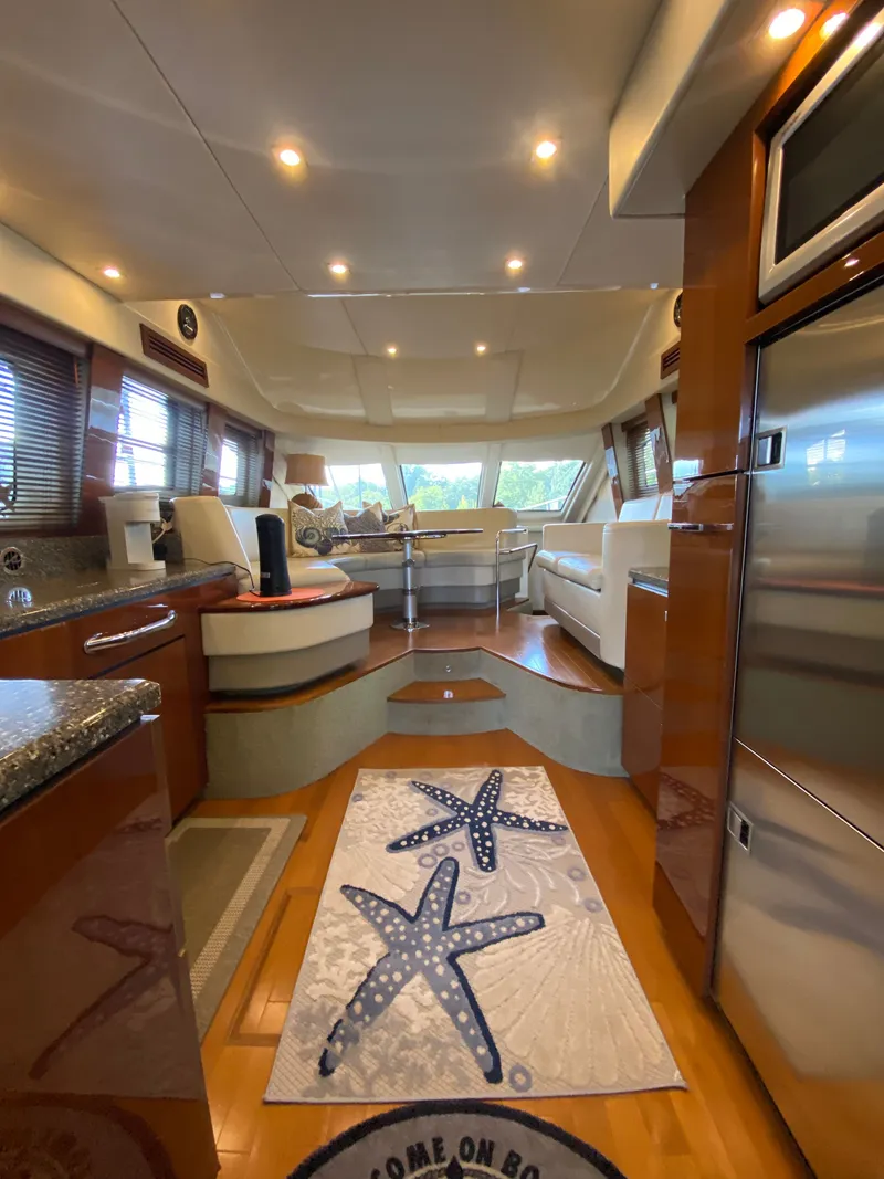 Slide: The Image of Luxurious interior of 2008 Sea Ray 47DB yacht with modern furnishings and starfish-themed decor. - 6
