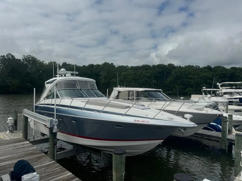 Slide: The Image of 2023 Formula 40 PC yacht docked at marina under cloudy sky. - 1