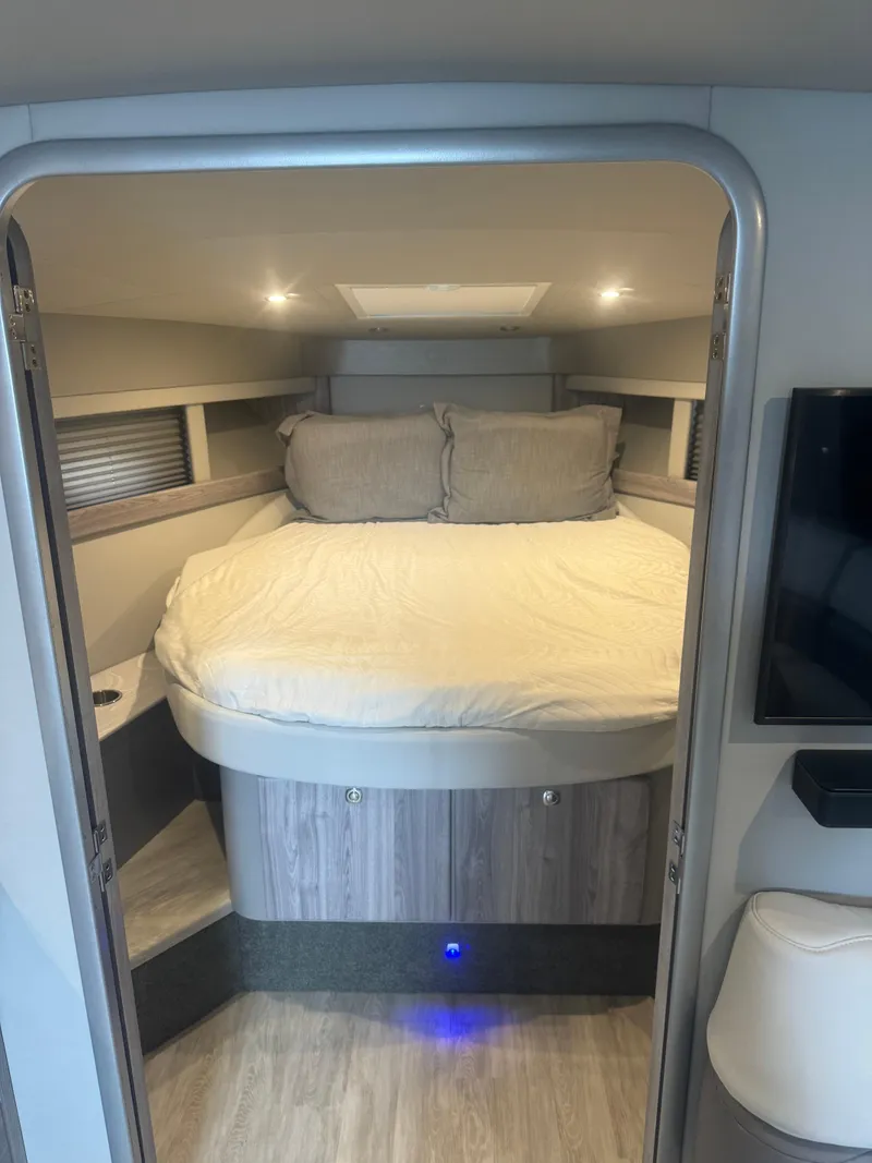 Slide: The Image of 2023 Formula 40 PC yacht interior with bedroom, TV, and modern decor. - 18