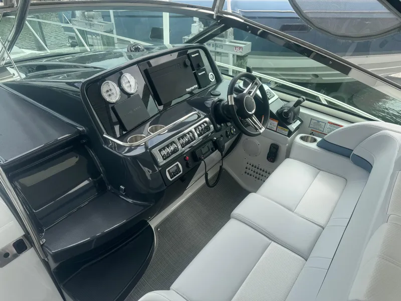Slide: The Image of Luxurious seating area on 2023 Formula 40 PC yacht with white and blue upholstery. - 8