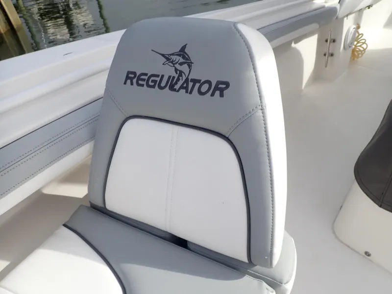 Slide: The Image of Gray and white seat on 2020 Regulator 23 Center Console boat. - 13