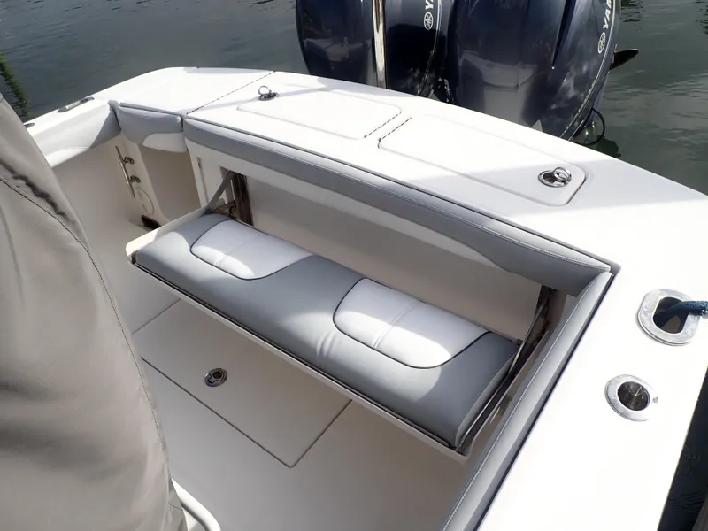 Slide: The Image of 2020 Regulator 23 Center Console boat with cushioned seating and dual outboard motors. - 21