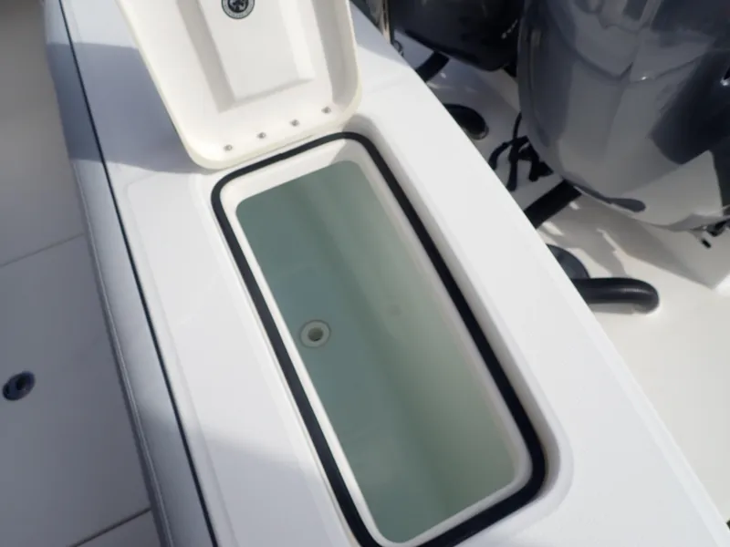 Slide: The Image of Open storage compartment on 2020 Regulator 23 Center Console boat. - 29