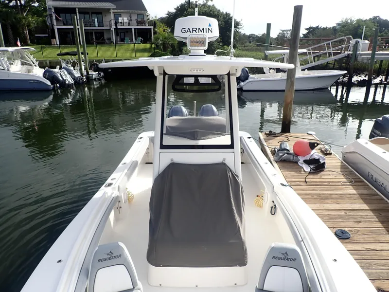Slide: The Image of 2020 Regulator 23 Center Console boat docked with Garmin equipment. - 4