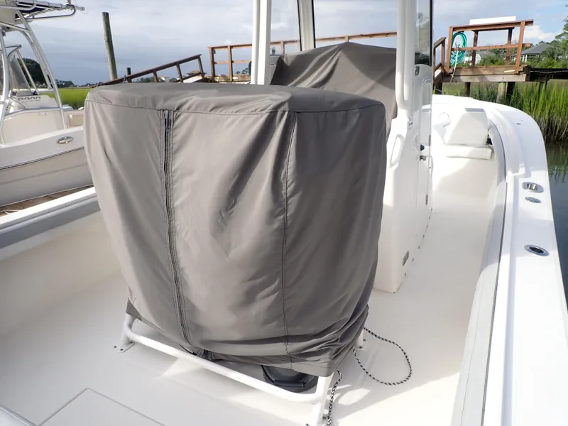 Slide: The Image of 2020 Regulator 23 Center Console boat with covered seating on deck. - 8