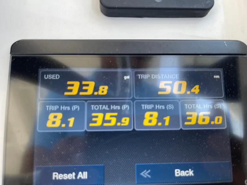 Slide: The Image of Display screen showing fuel usage and trip data for 2021 Edgewater 262 CX boat. - 17
