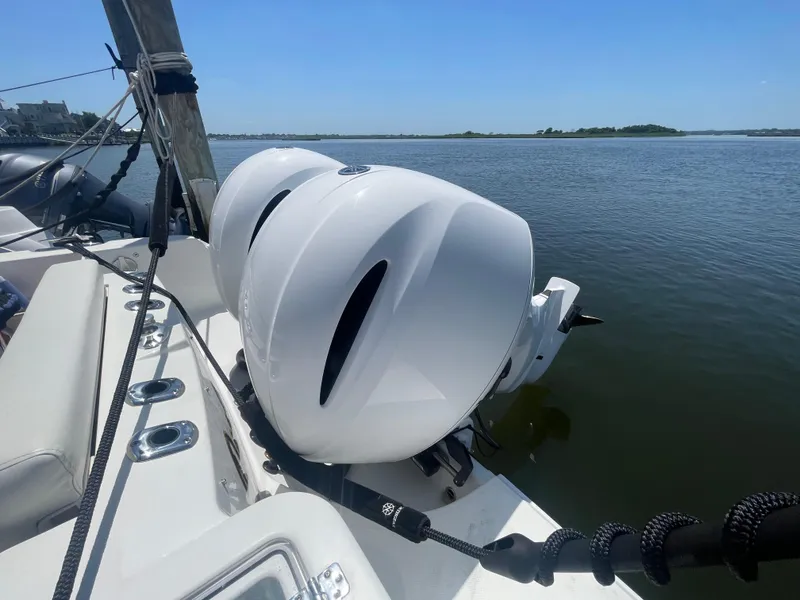 Slide: The Image of Edgewater 262 CX 2021 boat with dual engines on calm water. - 39